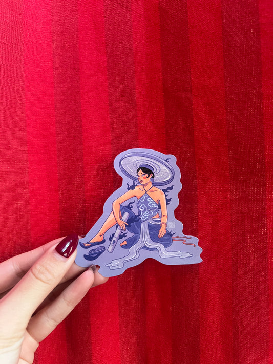 Sticker of a person in Vietnamese ao yem on a red fabric background